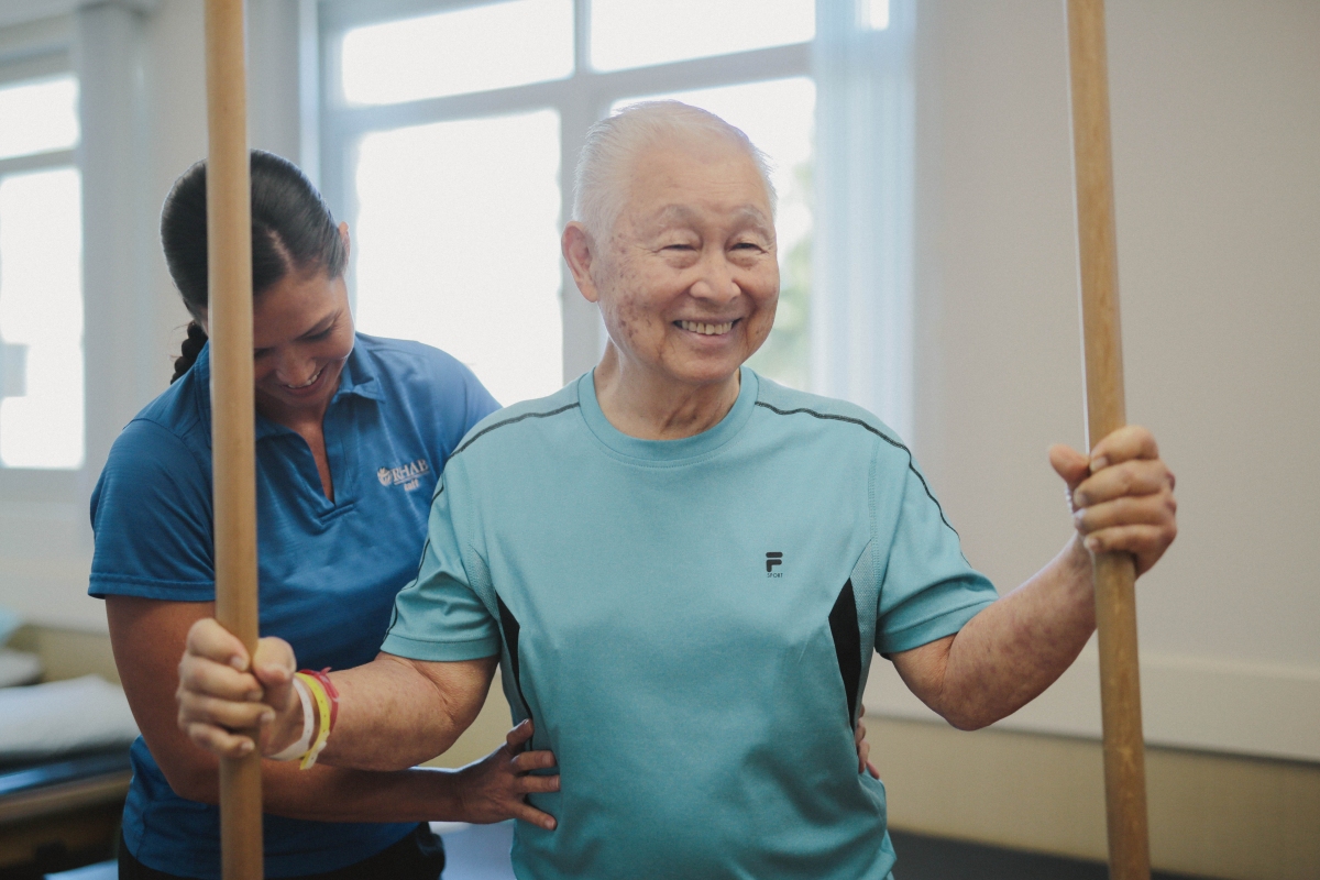Rehab patient being assisted with therapy