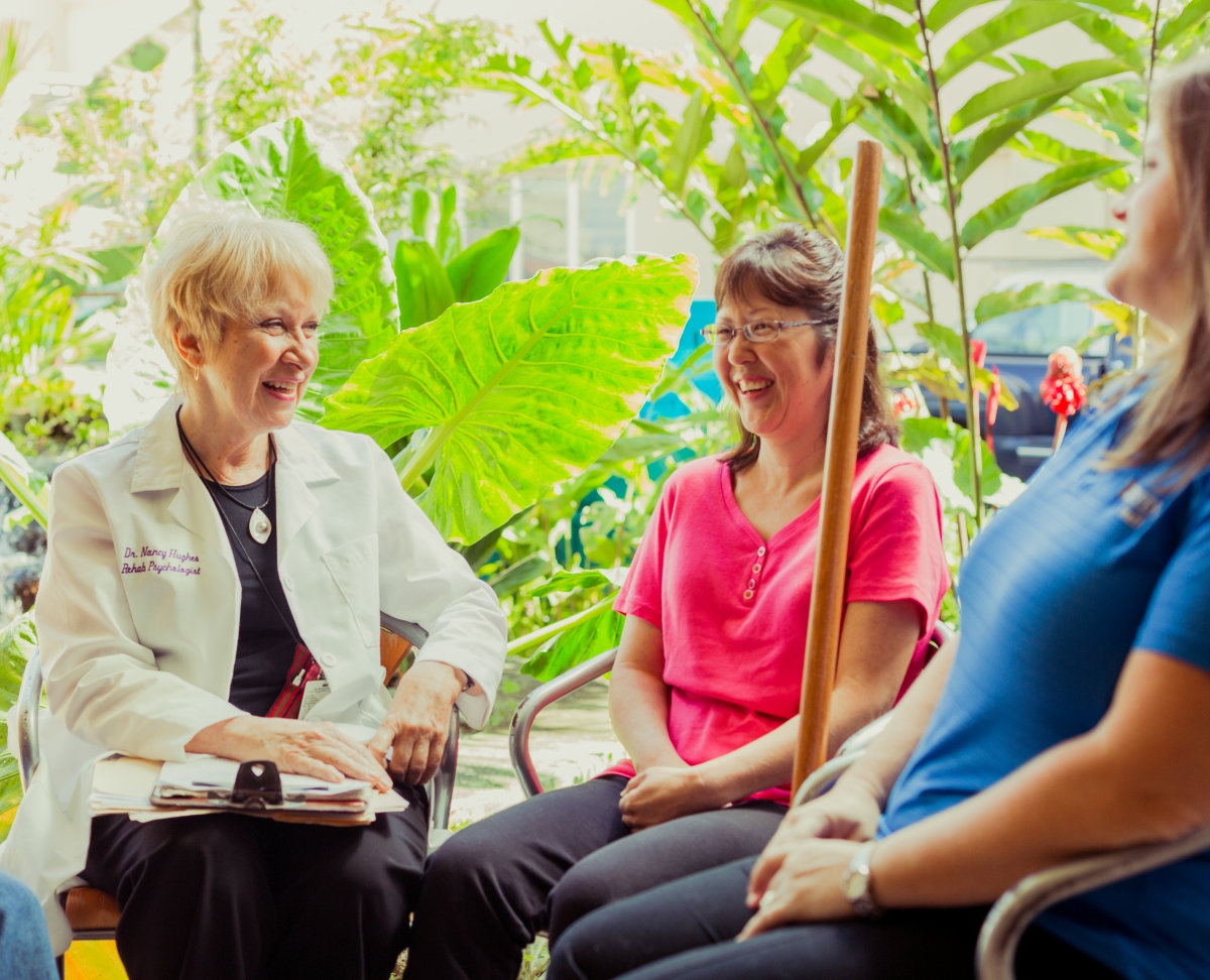 Rehab staff working with spinal cord injury rehabilitation patients