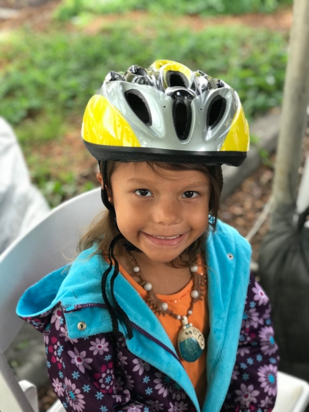 Child getting helmet fitted at child & youth day 2018