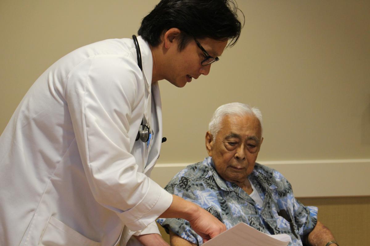 Doctor showing patient his charts