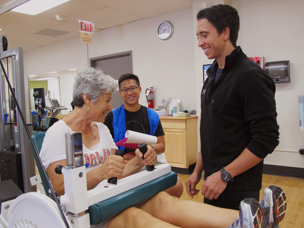 Student and supervisor with patient on grip machine