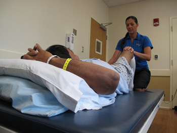 Freddie Agustin getting physical therapy from therapist Freddie Agustin getting physical therapy from therapist