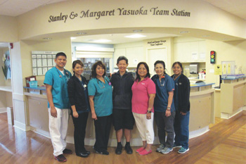 Group in front of the Stanley & Margaret Yasuoka Team Station Stanley & Margaret Yasuoka Team
