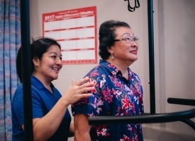 Staff assisting patient with Bertec Balance Master