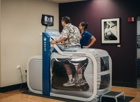 Patient using the Alter-G treadmill
