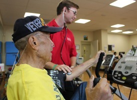 Assistant taking patient's vital signs during for a cardio pulmonary test