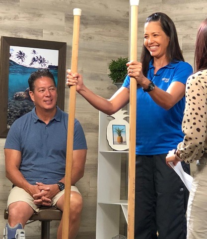 therapist demonstrates various equipment on HI Now TV segment