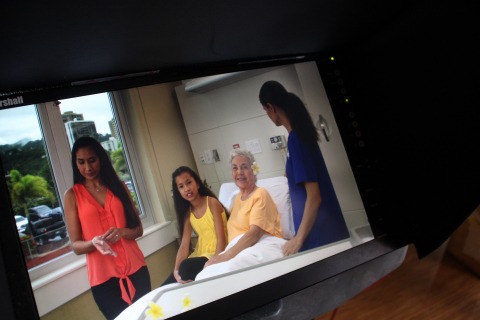 family and nurse in patient room