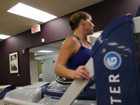 woman working out on a machine