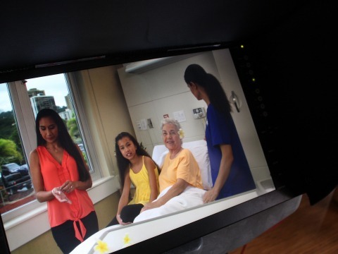 family and nurse in patient room