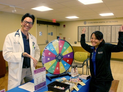 Rehab staff playing wheel spinning game