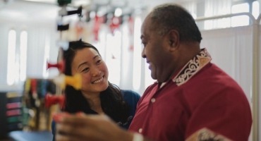 REHAB staff member helping stroke rehabilitation patient