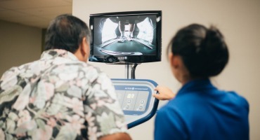 patient using alterg with therapist